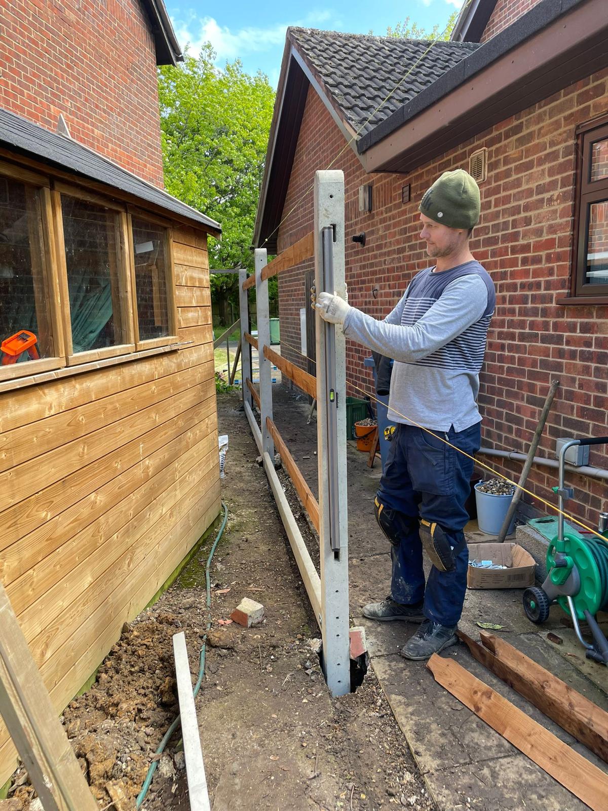 X-Fence professional installing fence posts